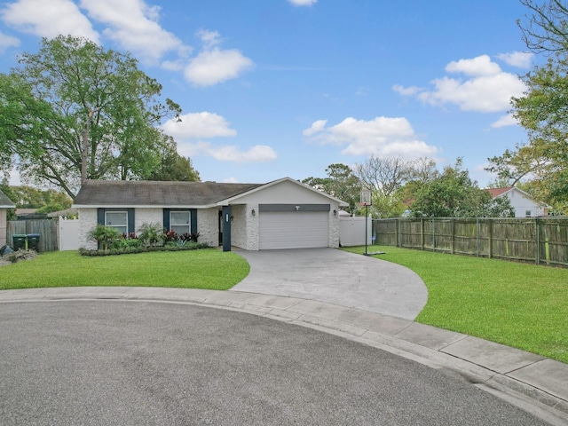 ranch-style home featuring a garage, fence, and a front lawn