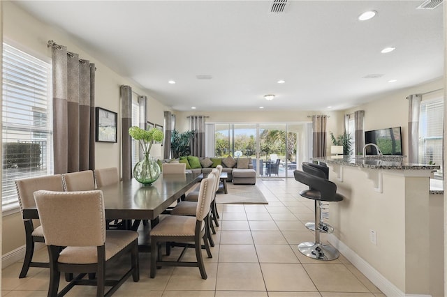 dining room with light tile patterned floors, visible vents, and recessed lighting