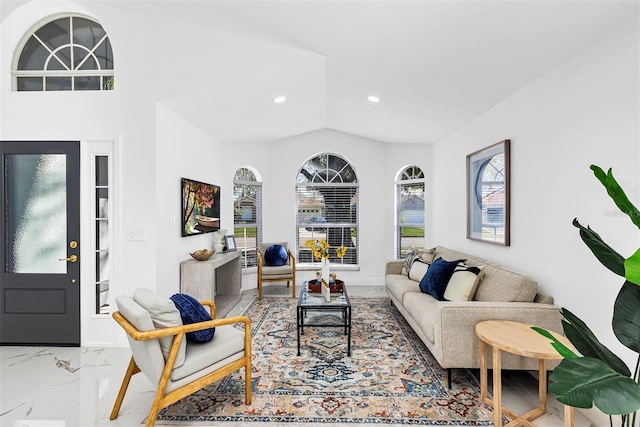 living area featuring a wealth of natural light, marble finish floor, lofted ceiling, and recessed lighting