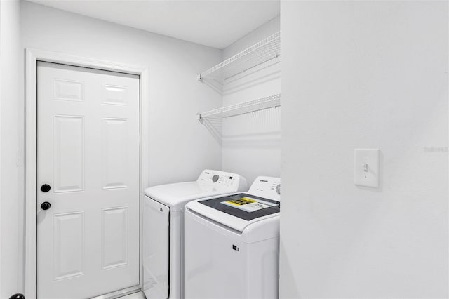 laundry room with washing machine and dryer and laundry area