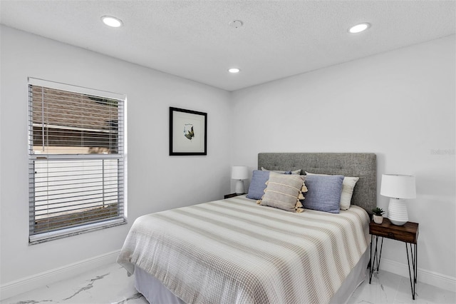 bedroom featuring marble finish floor, baseboards, a textured ceiling, and recessed lighting