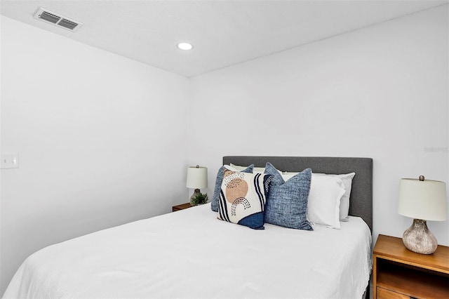 bedroom featuring visible vents and recessed lighting