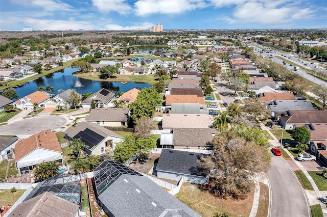 bird's eye view with a water view and a residential view