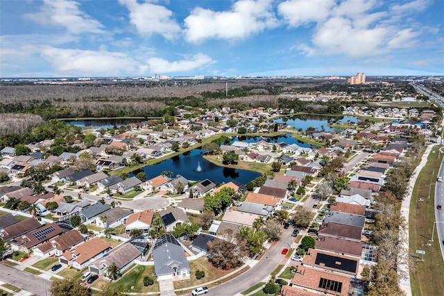 drone / aerial view with a water view and a residential view