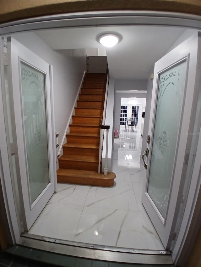 stairs with marble finish floor