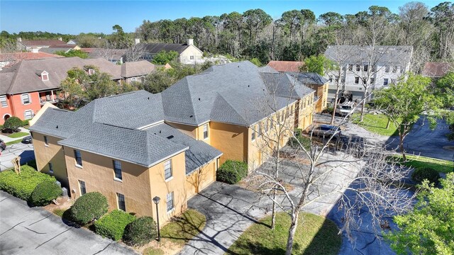 birds eye view of property with a residential view