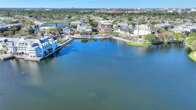 drone / aerial view featuring a residential view and a water view