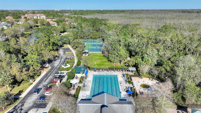 birds eye view of property with a forest view