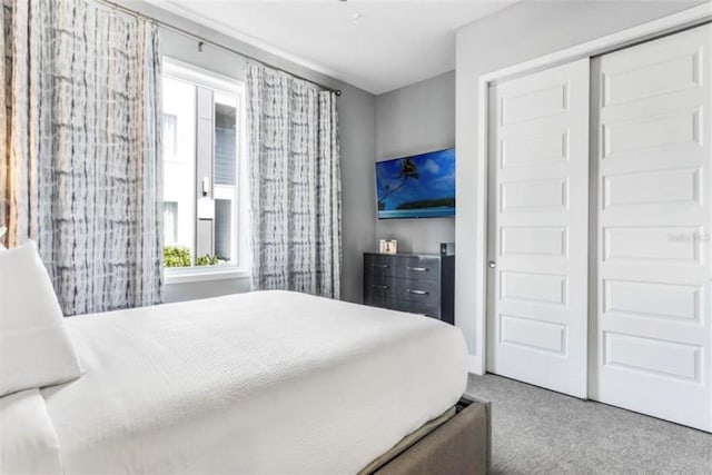 carpeted bedroom with a closet