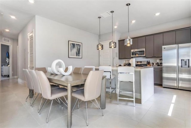 dining space featuring recessed lighting and visible vents