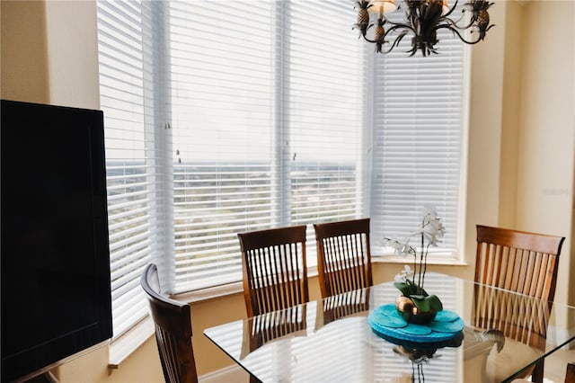 dining space featuring an inviting chandelier and a wealth of natural light