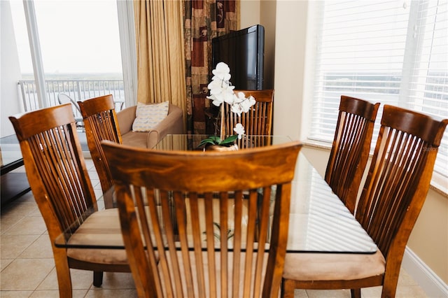 dining area featuring tile patterned flooring