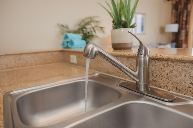 details featuring light countertops and a sink