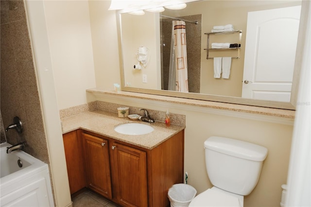 full bath featuring vanity, tile patterned floors, and toilet