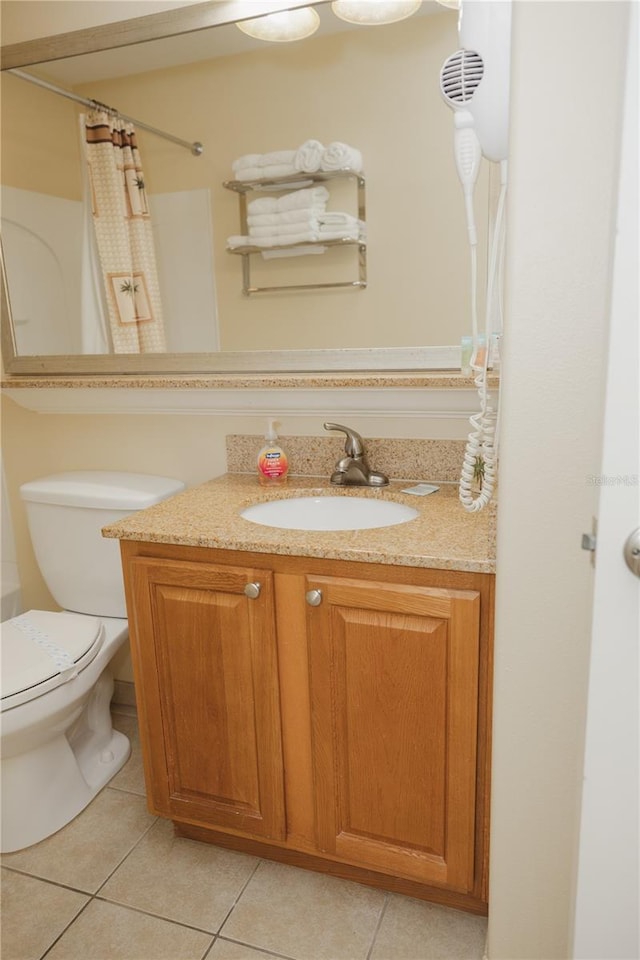 full bath with tile patterned flooring, toilet, curtained shower, and vanity