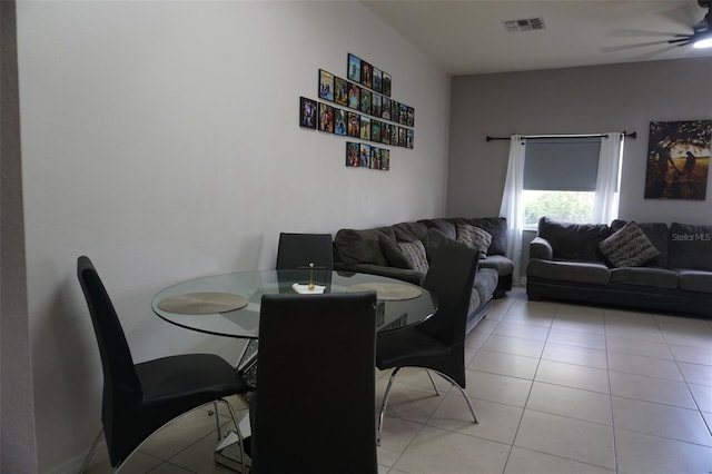 dining space with a ceiling fan, visible vents, and light tile patterned floors