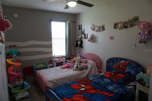 bedroom with a ceiling fan and wood finished floors