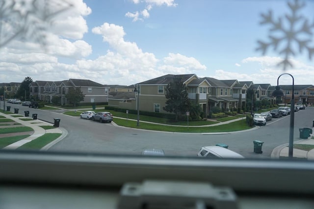 view of street featuring a residential view, curbs, and sidewalks