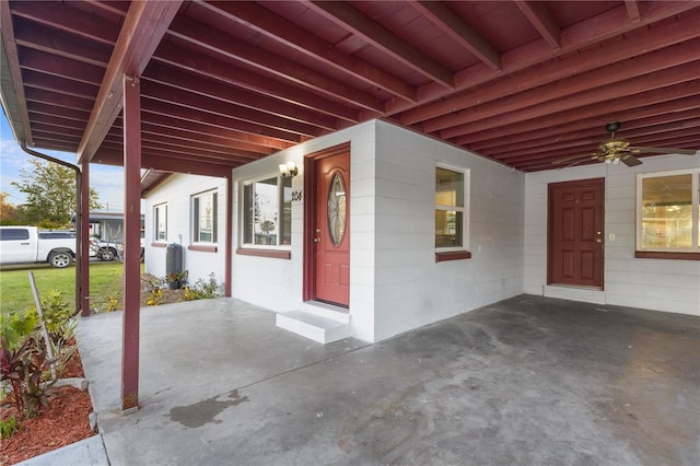 view of patio / terrace featuring a carport and a ceiling fan