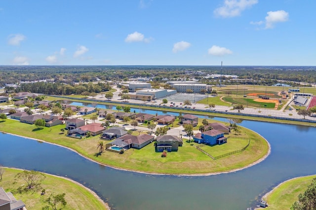 bird's eye view with a water view and a residential view