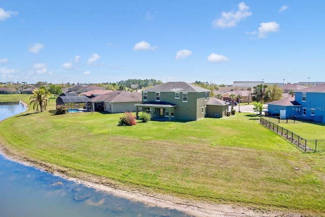 exterior space featuring a residential view and a water view