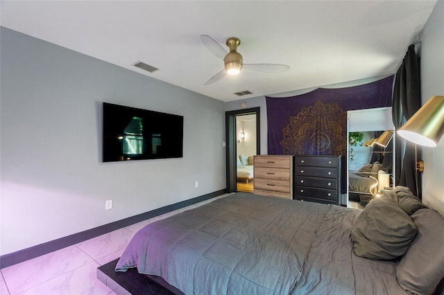 bedroom with a ceiling fan, visible vents, and baseboards