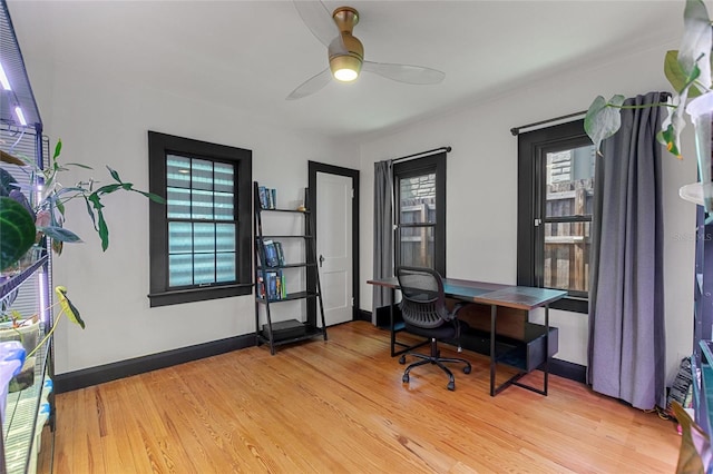 office with ceiling fan, wood finished floors, and baseboards