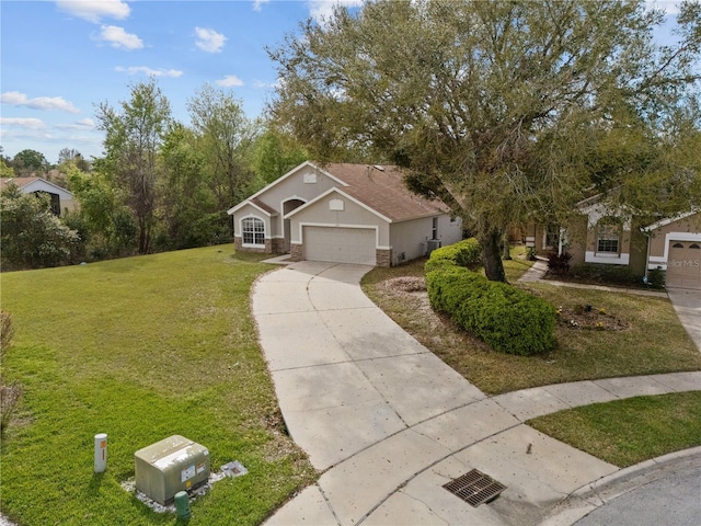 view of front of home featuring stucco siding, concrete driveway, an attached garage, a front yard, and stone siding