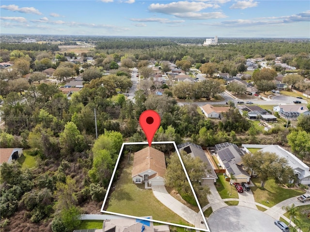 bird's eye view featuring a residential view and a forest view