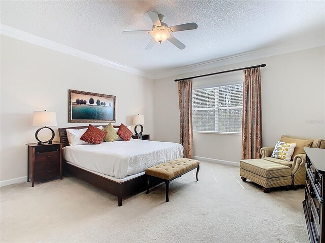 bedroom featuring light carpet, a textured ceiling, and crown molding