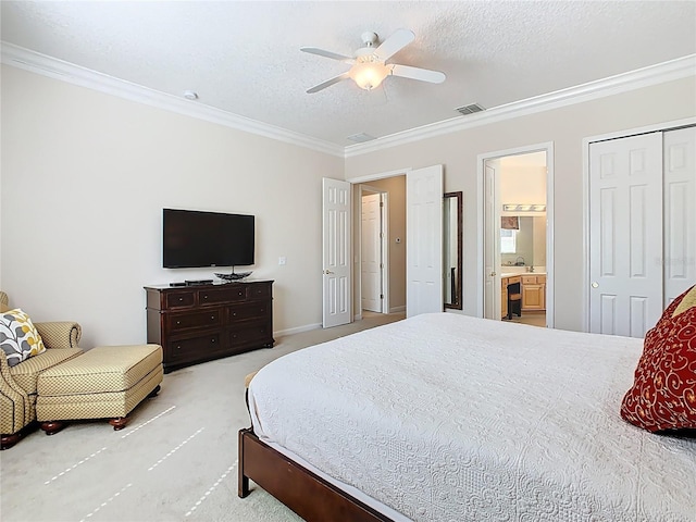 bedroom featuring ornamental molding, carpet, visible vents, and a textured ceiling