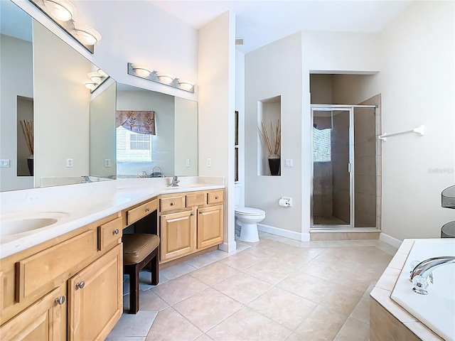 full bathroom with double vanity, a stall shower, toilet, a garden tub, and tile patterned flooring