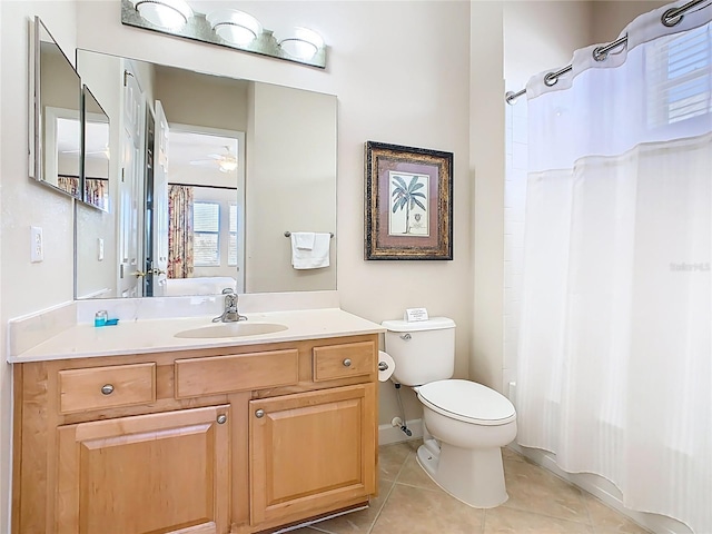 bathroom with toilet, tile patterned flooring, a shower with shower curtain, and vanity