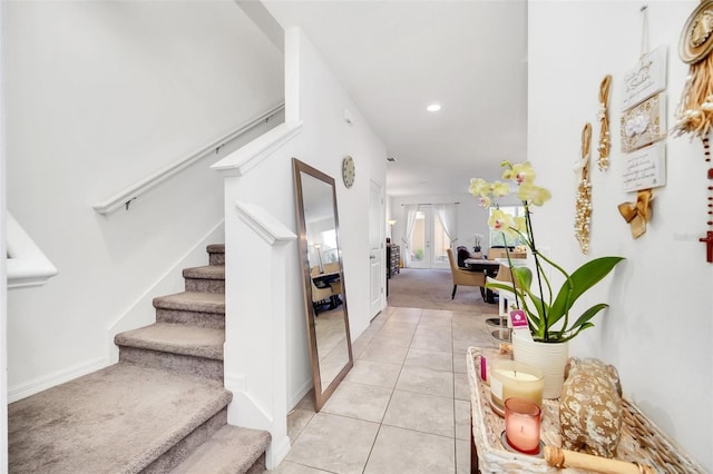 interior space with tile patterned floors, baseboards, carpet, and recessed lighting