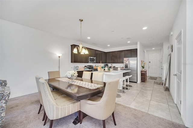 dining space with light tile patterned floors, recessed lighting, light colored carpet, and a notable chandelier