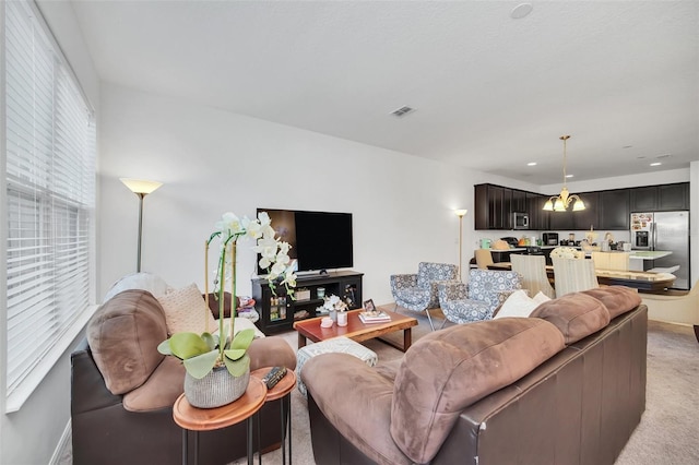 living room with light carpet, visible vents, and recessed lighting