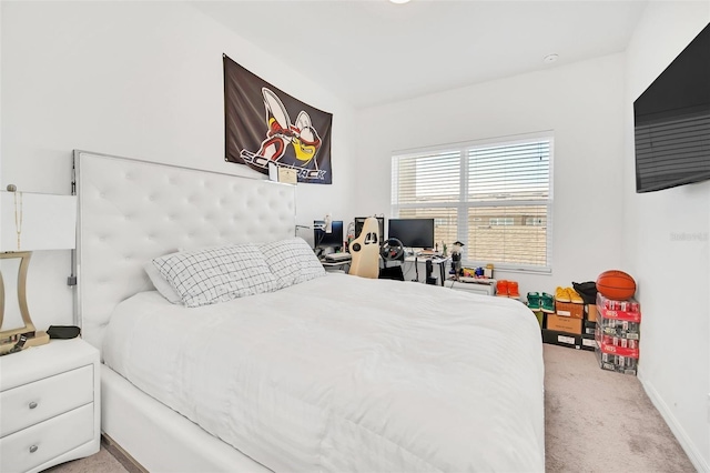 carpeted bedroom with baseboards