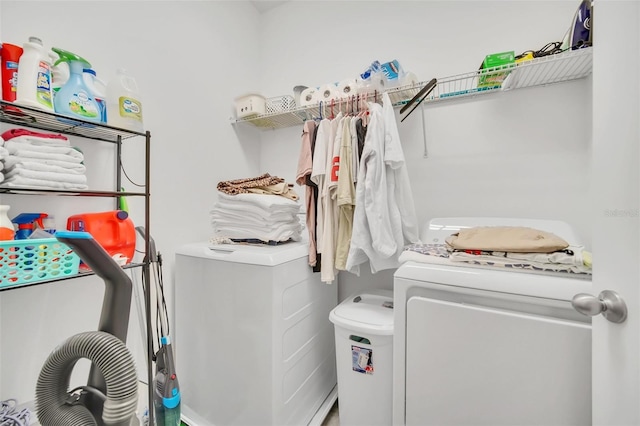 laundry area with separate washer and dryer and laundry area