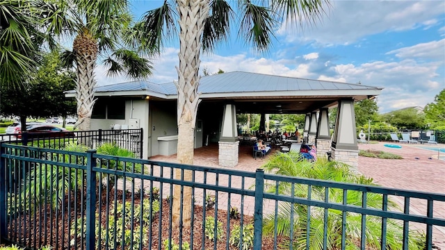 view of community featuring fence