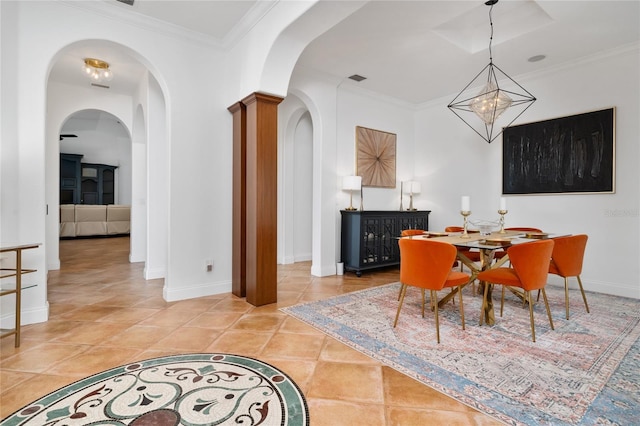 dining room featuring a notable chandelier, ornamental molding, light tile patterned flooring, and baseboards