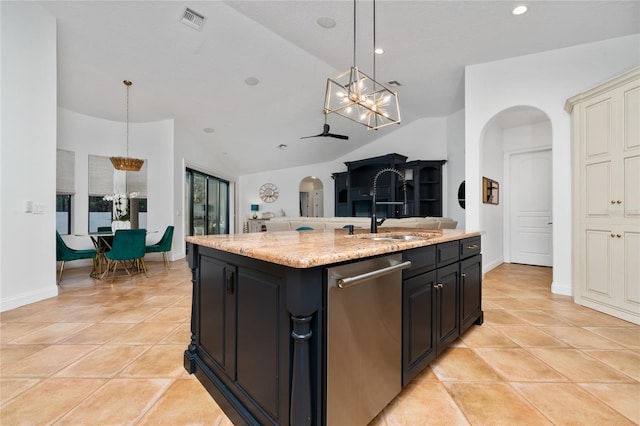 kitchen with arched walkways, visible vents, a sink, and stainless steel dishwasher