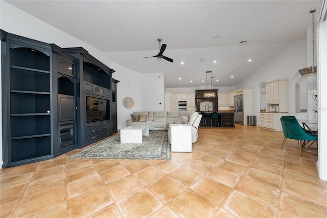 unfurnished living room with arched walkways, recessed lighting, light tile patterned flooring, vaulted ceiling, and ceiling fan