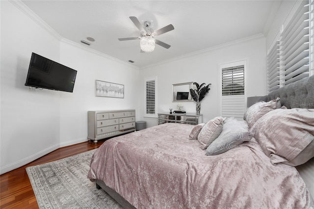 bedroom featuring crown molding, visible vents, baseboards, and dark wood-style flooring