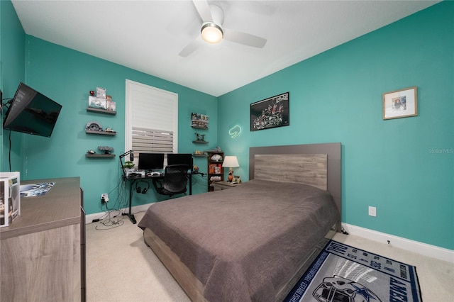 carpeted bedroom with baseboards and a ceiling fan