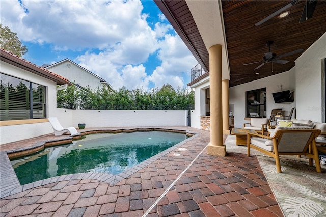 view of swimming pool featuring a fenced in pool, fence private yard, ceiling fan, and a patio