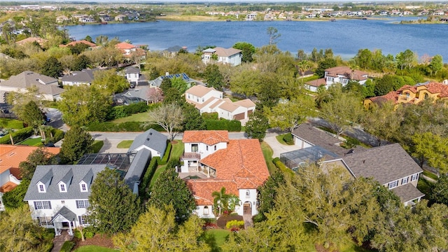 birds eye view of property featuring a residential view and a water view