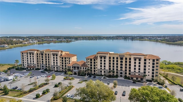 birds eye view of property with a water view