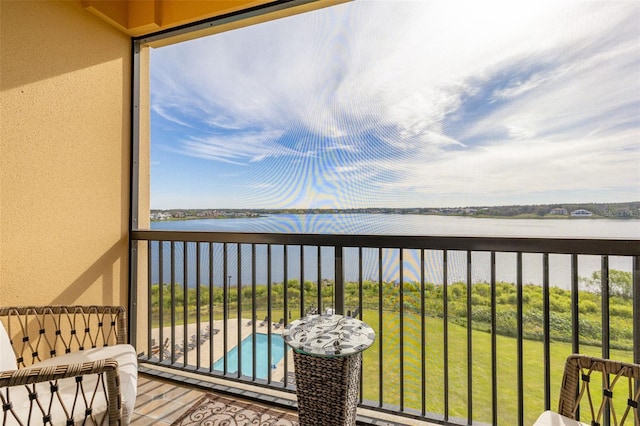 balcony featuring a water view