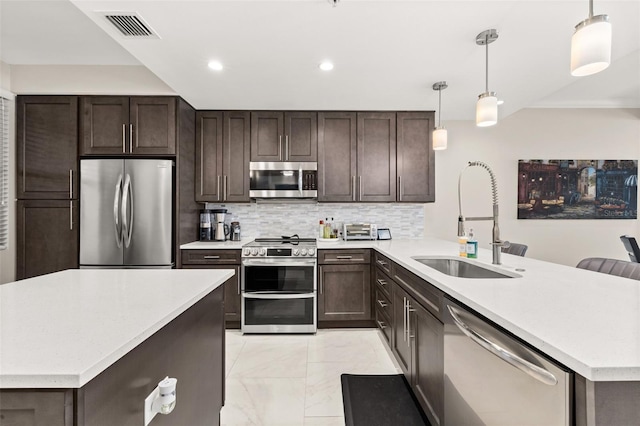 kitchen featuring a sink, visible vents, marble finish floor, dark brown cabinets, and appliances with stainless steel finishes