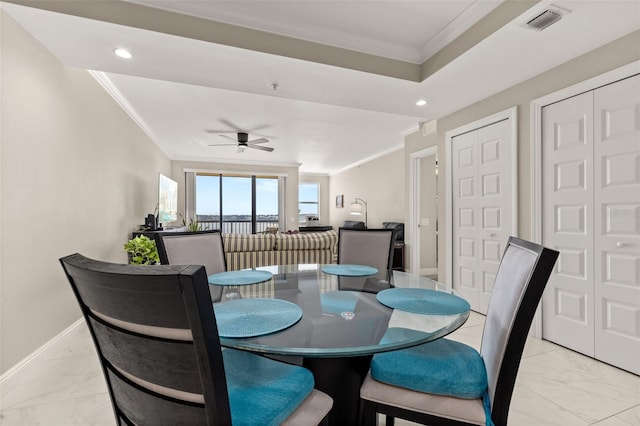 dining area featuring ornamental molding, marble finish floor, visible vents, and baseboards